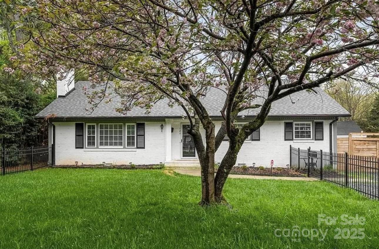 782 Union Street South Concord, NC 28025 - Photo 1 of 19 a front view of a house with a garden and trees