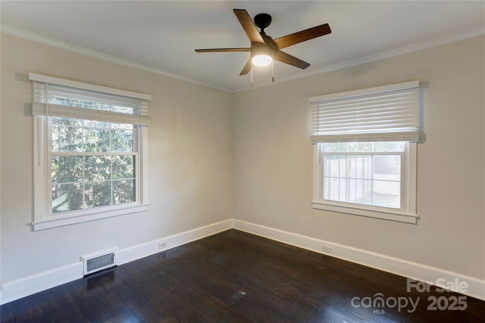782 Union Street South Concord, NC 28025 - Photo 14 of 19 a view of a big room with wooden floor and windows