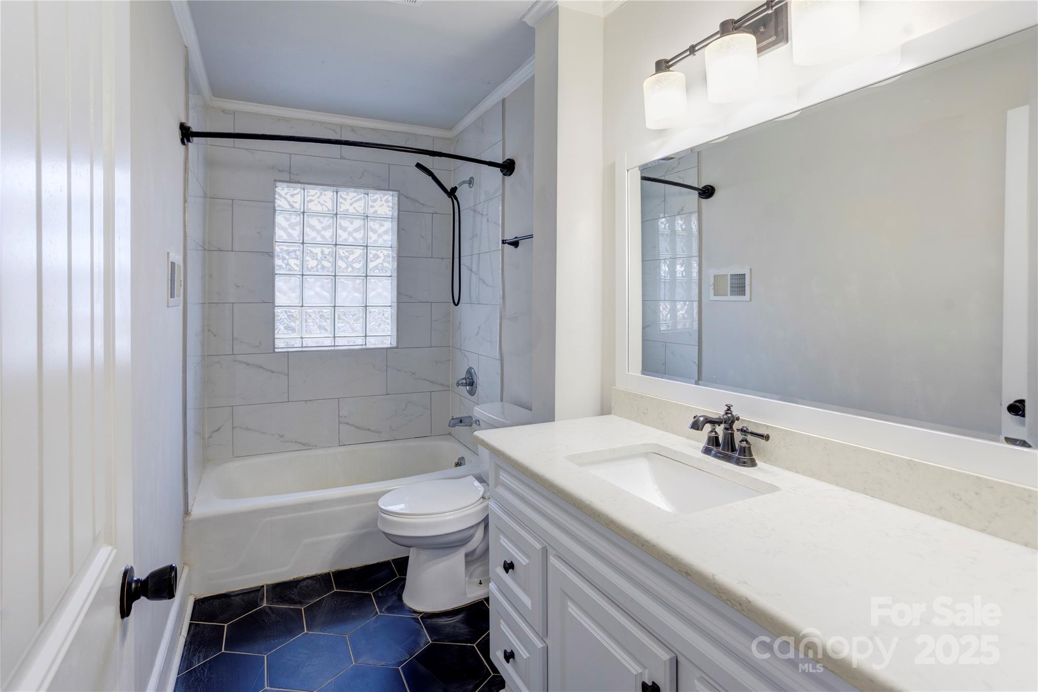 782 Union Street South Concord, NC 28025 - Photo 15 of 19 a bathroom with a sink toilet and shower