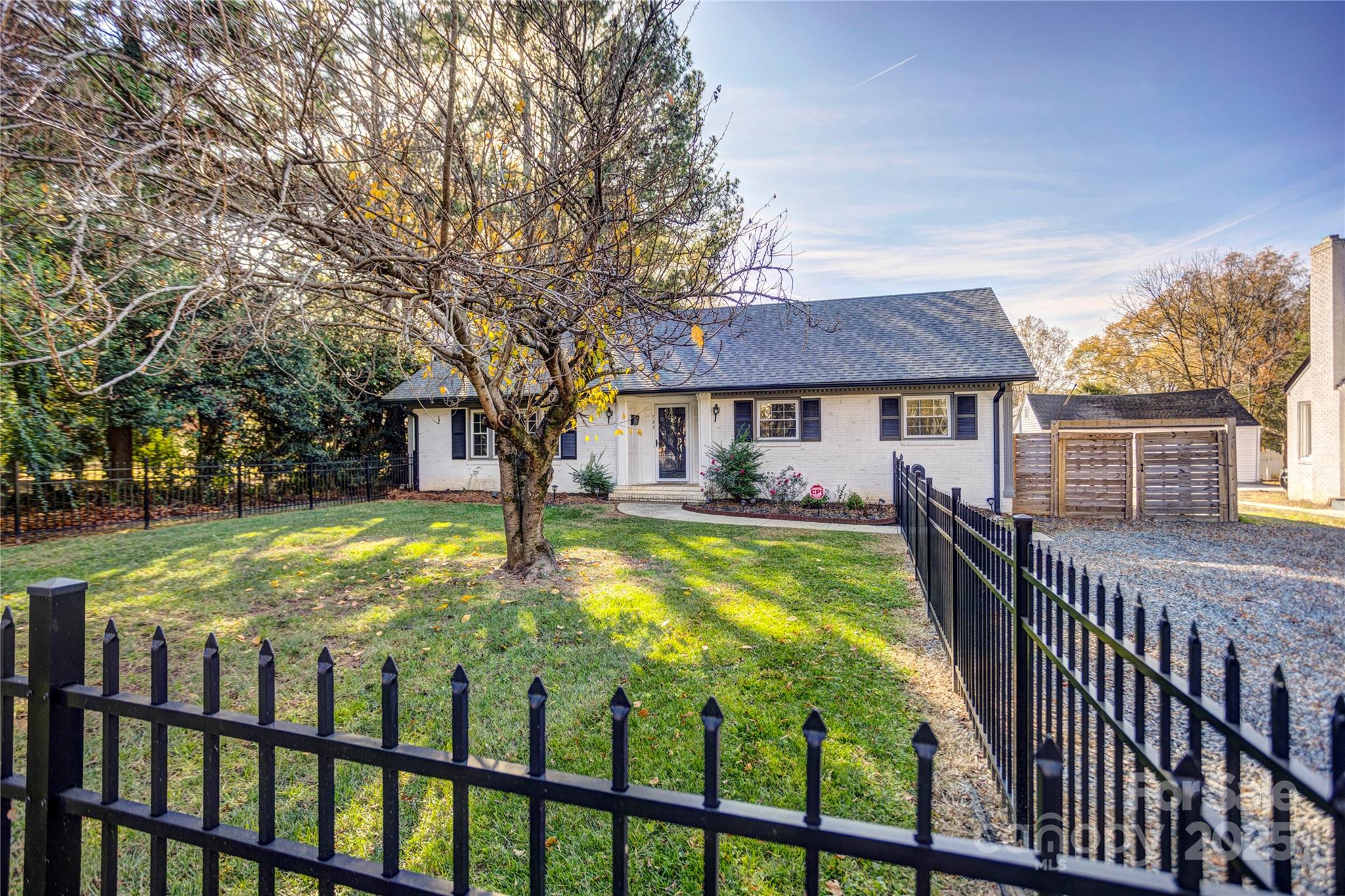 782 Union Street South Concord, NC 28025 - Photo 2 of 19 a view of a brick house with a large pool table and chairs