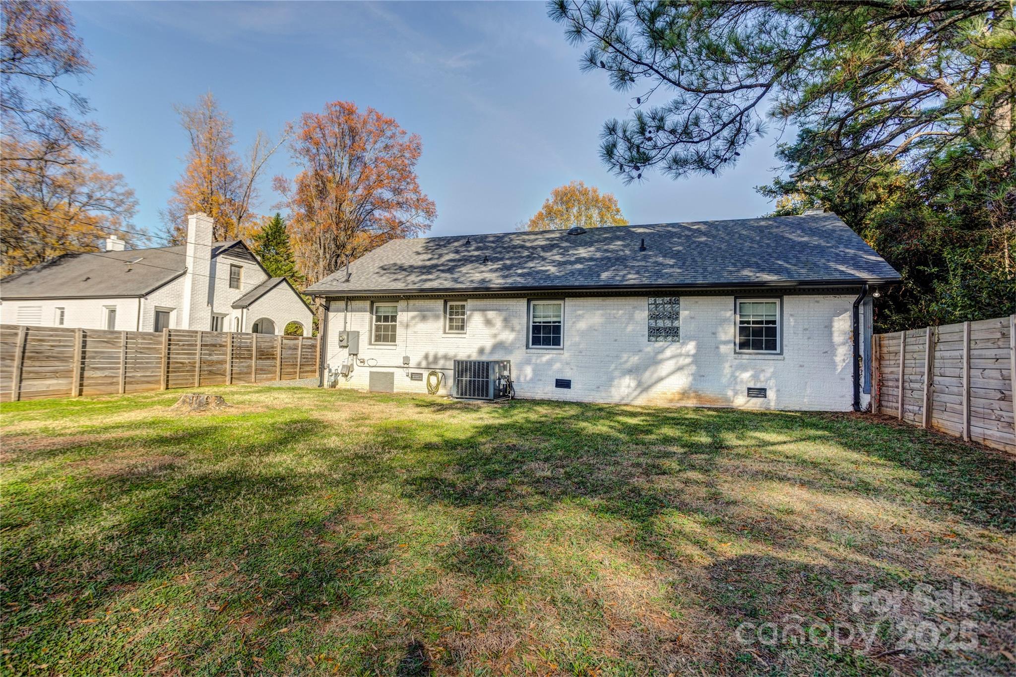 782 Union Street South Concord, NC 28025 - Photo 5 of 19 a view of a house with a backyard and a tree
