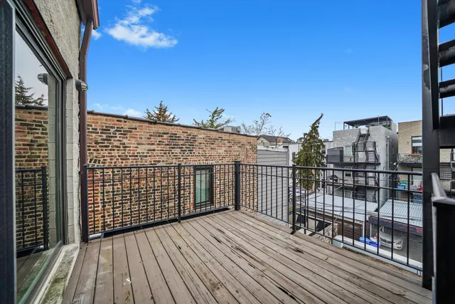 a view of balcony with wooden floor