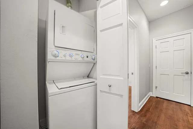 a view of a storage & utility room with dryer and washer