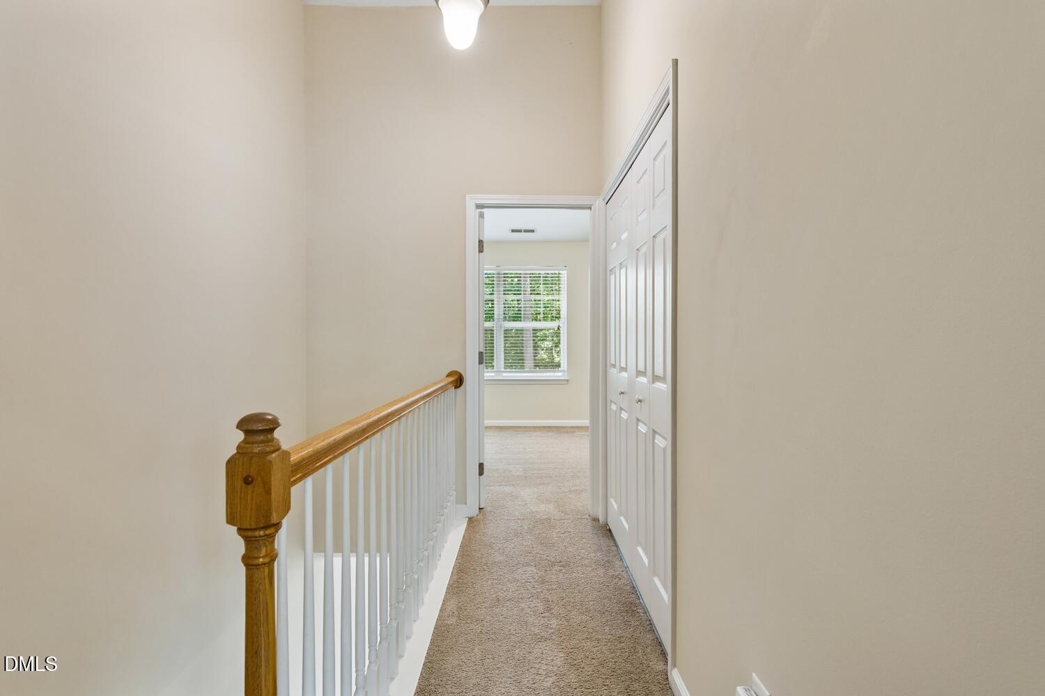 3635 Bison Hill Lane Raleigh, NC 27604 - Photo 10 of 18 a view of a hallway with a window