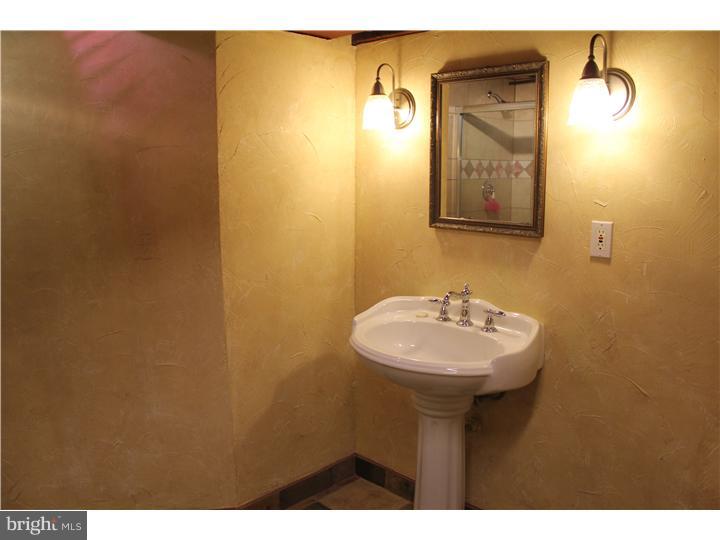 431 Farwood Road Haddonfield, NJ 08033 - Photo 22 of 23 a bathroom with a sink and a mirror