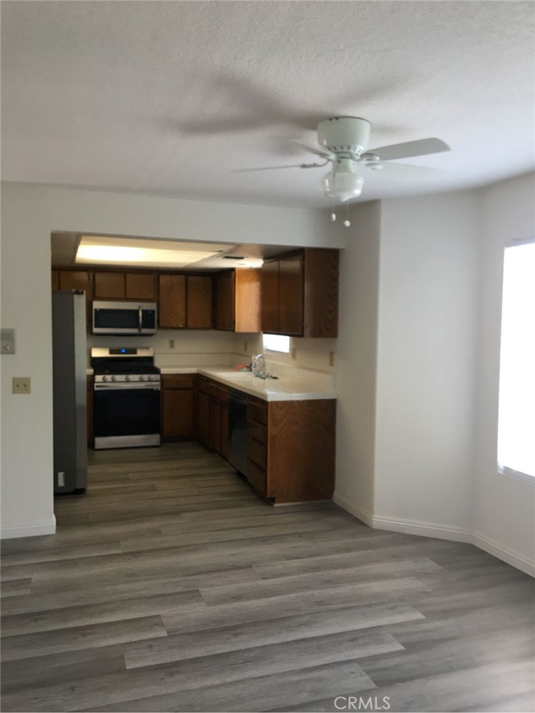 113 Diamond Street Arcadia, CA 91006 - Photo 19 of 24 a kitchen with kitchen island granite countertop a sink cabinets and stainless steel appliances