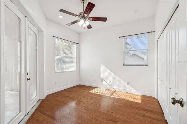 a bathroom with a granite countertop sink a toilet and a mirror