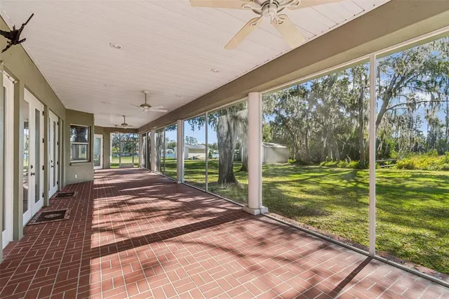 a bedroom with a large bed and a large window