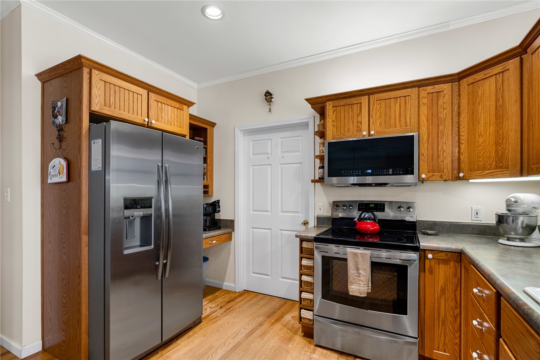 2803 Trail Road Belton, SC 29627 - Photo 12 of 48 This bright kitchen features wood cabinetry, stainless steel appliances, and gleaming hardwood floors.