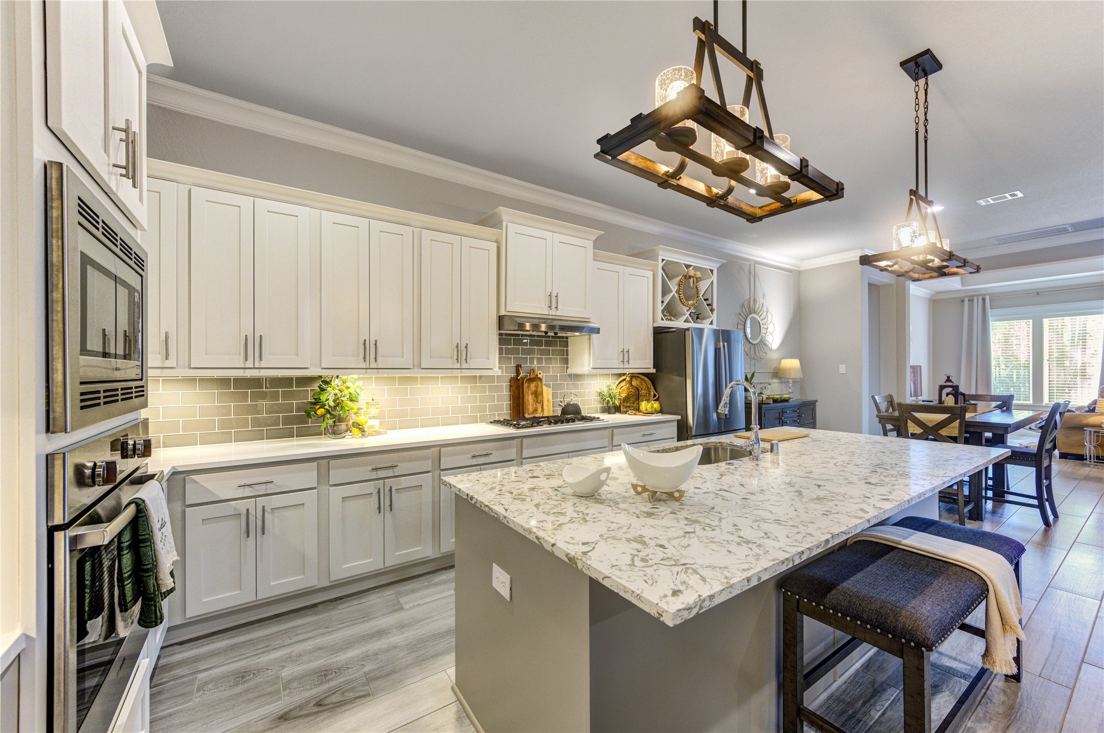 2160 Rope Maker Road Conroe, TX 77384 - Photo 13 of 43 a kitchen with a table and chairs in it