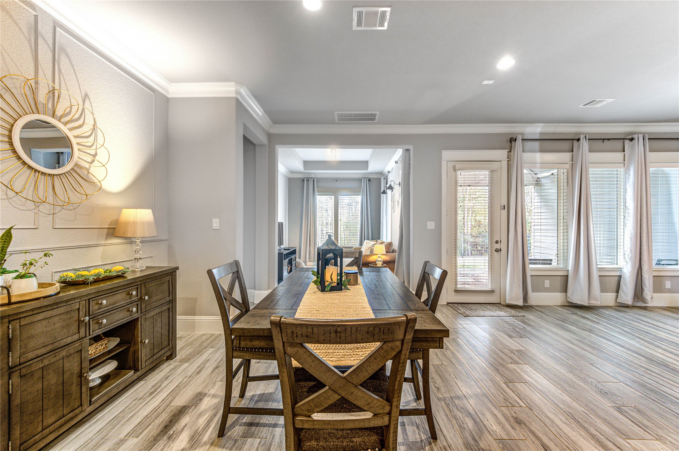 2160 Rope Maker Road Conroe, TX 77384 - Photo 17 of 43 a dining room with furniture and wooden floor