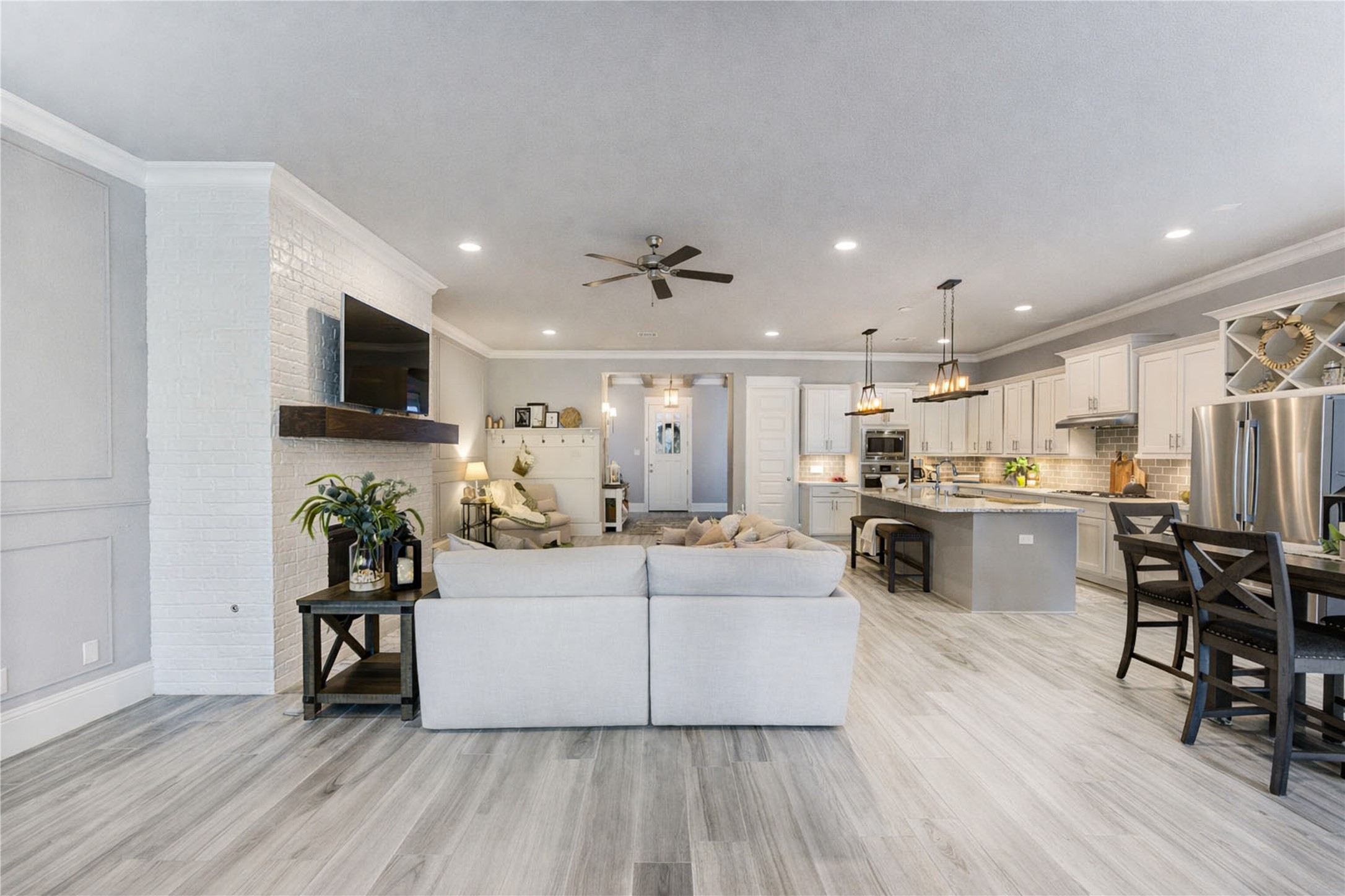 2160 Rope Maker Road Conroe, TX 77384 - Photo 22 of 43 a large white kitchen with a table and chairs