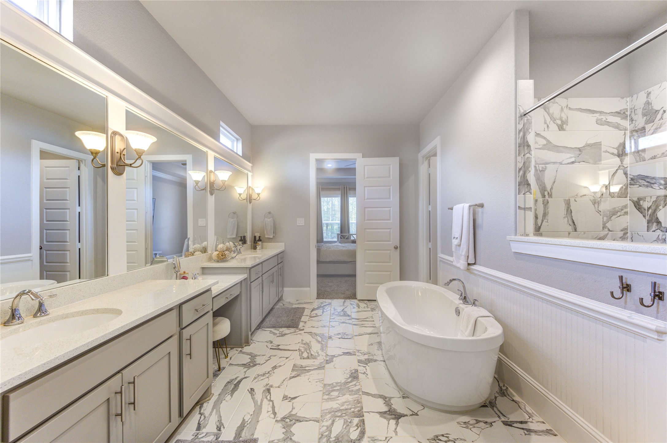 2160 Rope Maker Road Conroe, TX 77384 - Photo 25 of 43 a bathroom with a granite countertop sink mirror and bathtub