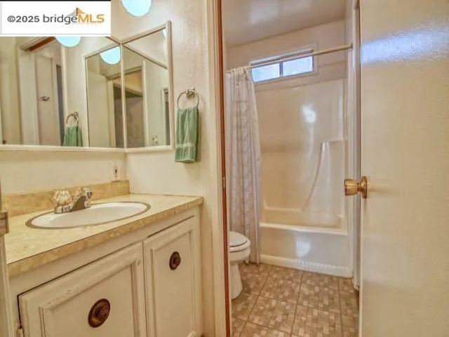 a bathroom with a sink a mirror and a shower