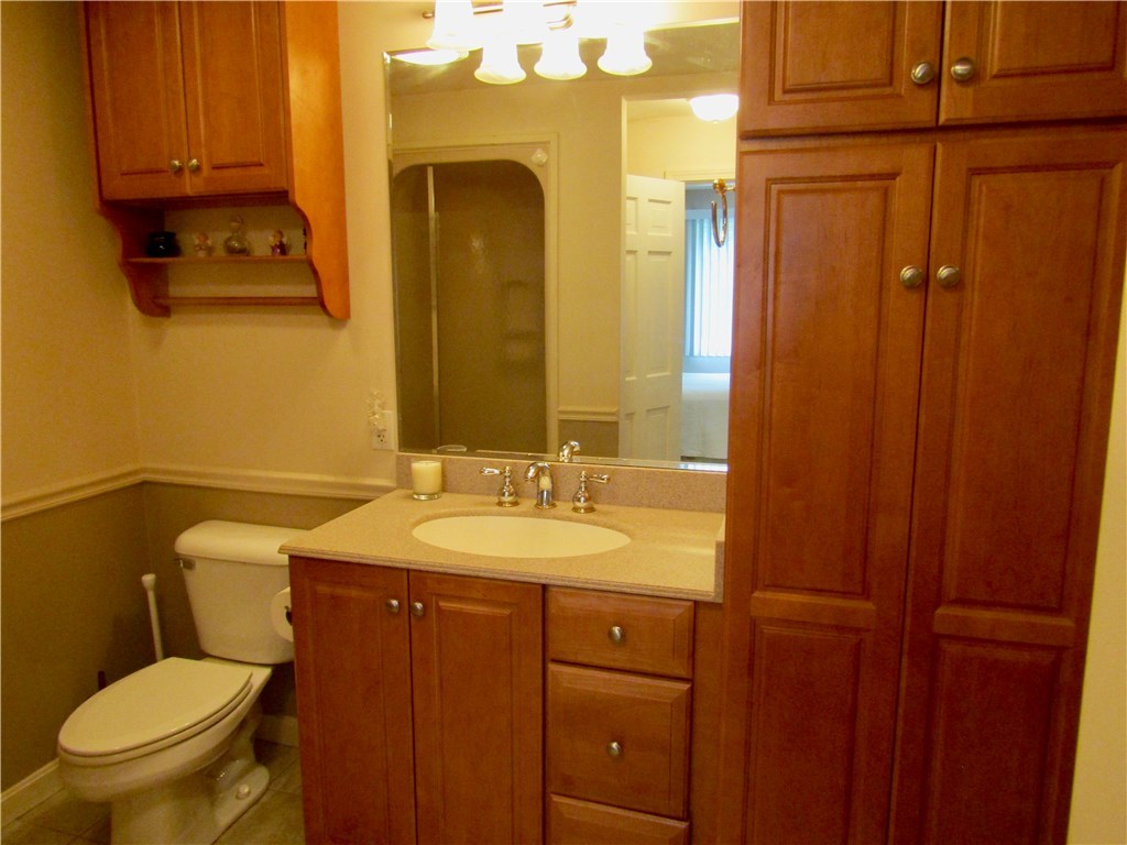 120 Burnt Swamp Road Cumberland, RI 02864 - Photo 19 of 37 first floor full bathroom with extra custom cabinets
