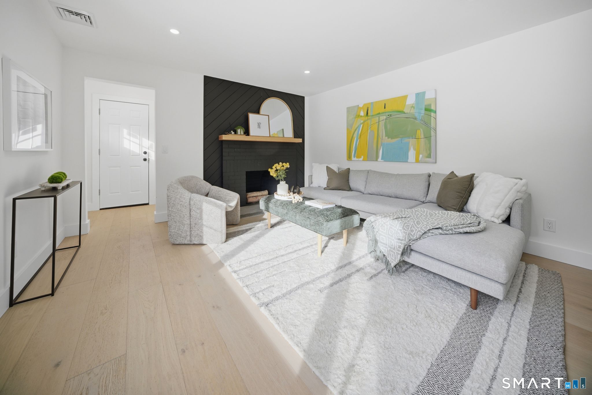 101 Parade Hill Road New Canaan, CT 06840 - Photo 12 of 40 a living room with furniture and a fireplace