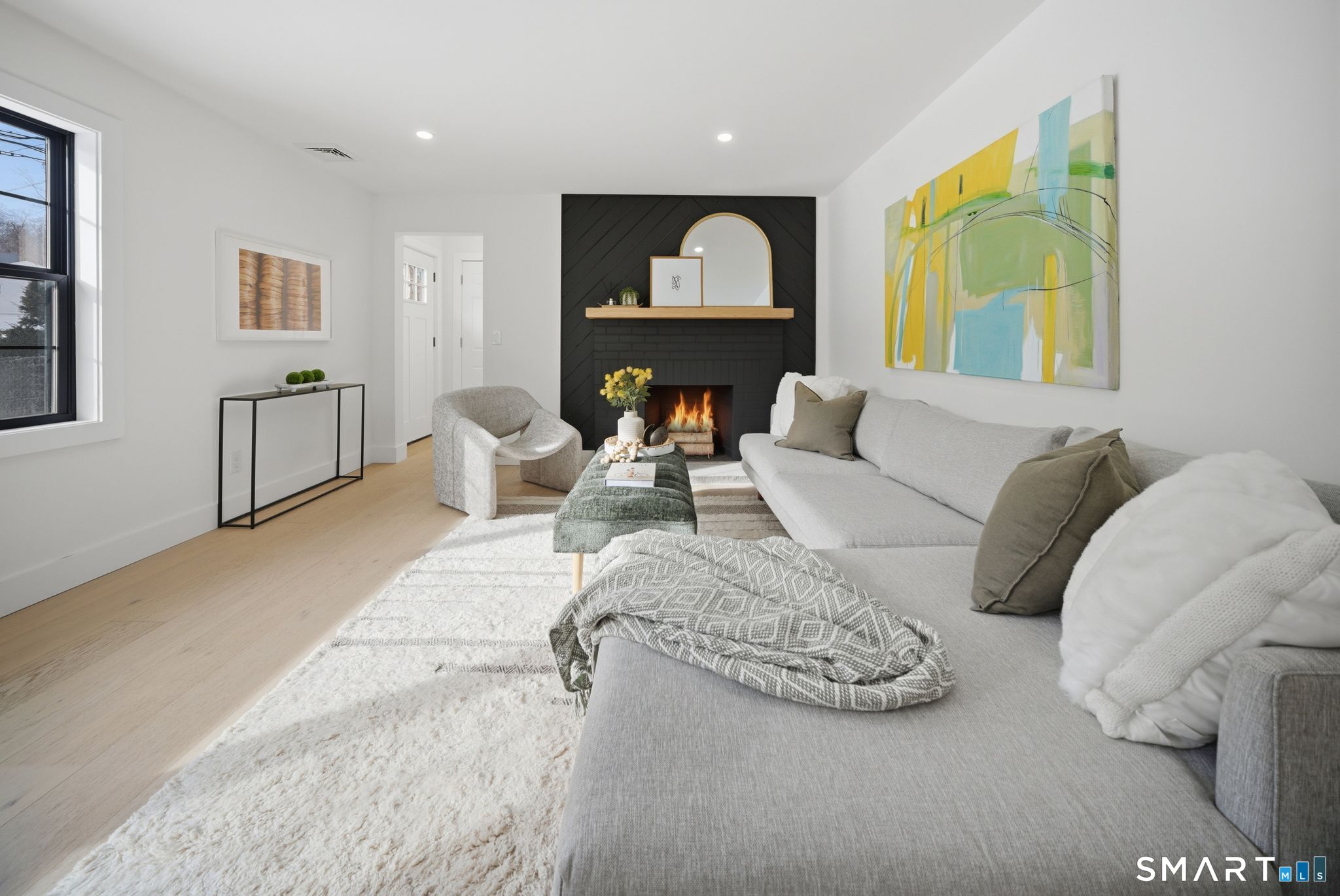 101 Parade Hill Road New Canaan, CT 06840 - Photo 13 of 40 a living room with furniture and a fireplace