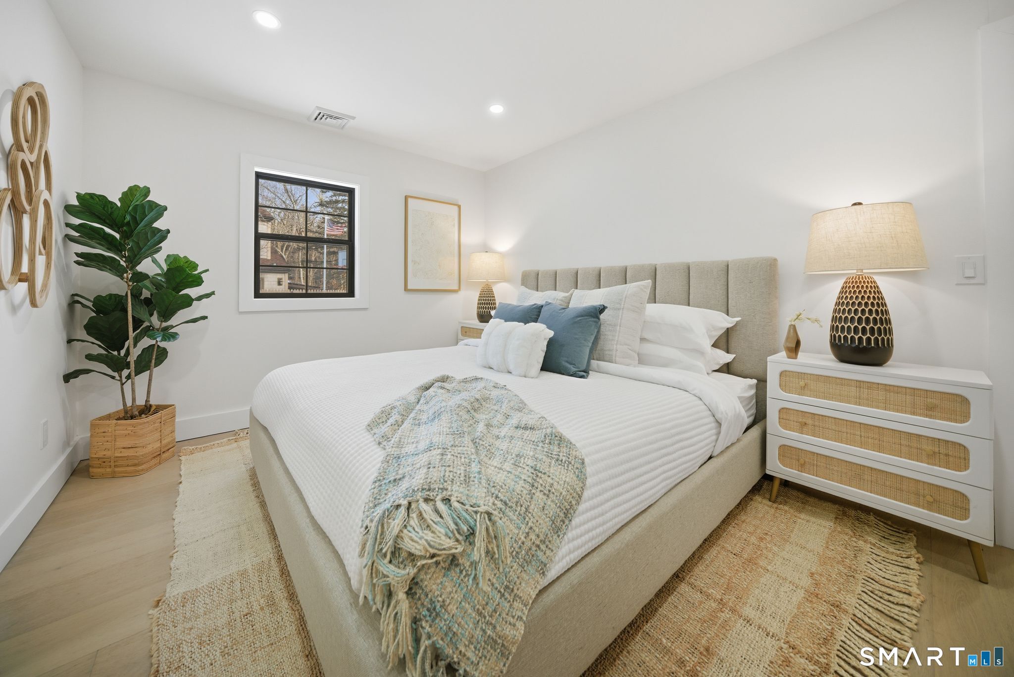 101 Parade Hill Road New Canaan, CT 06840 - Photo 21 of 40 a bedroom with a bed and a potted plant