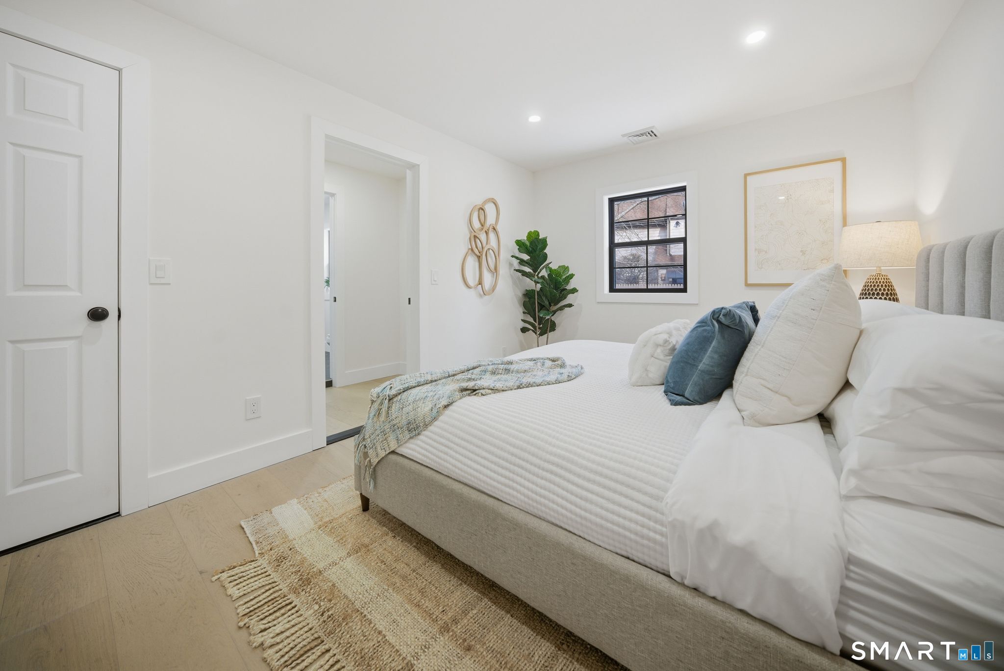 101 Parade Hill Road New Canaan, CT 06840 - Photo 23 of 40 a bedroom with a bed and a painting on the wall