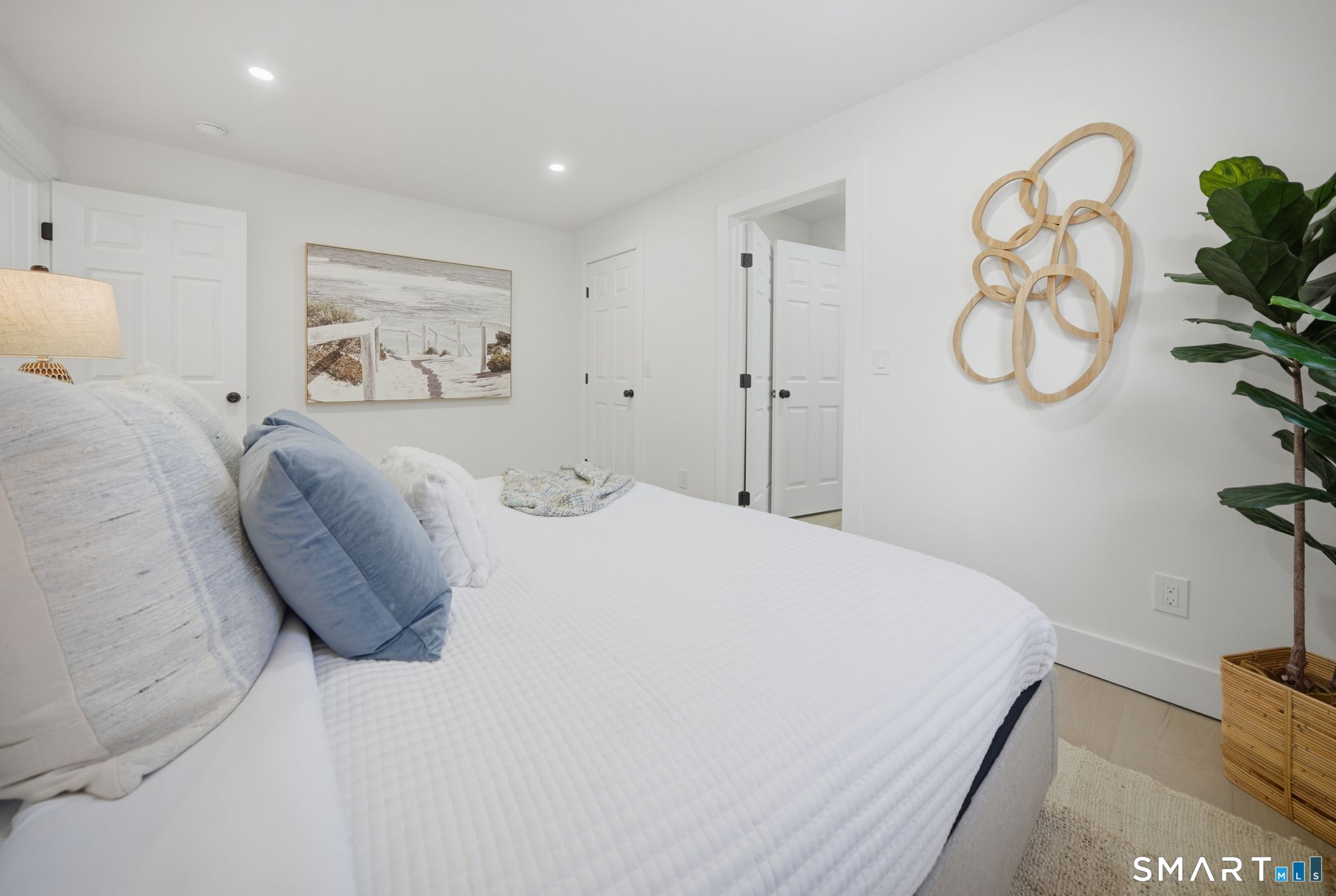 101 Parade Hill Road New Canaan, CT 06840 - Photo 24 of 40 a bedroom with a bed and with a chandelier