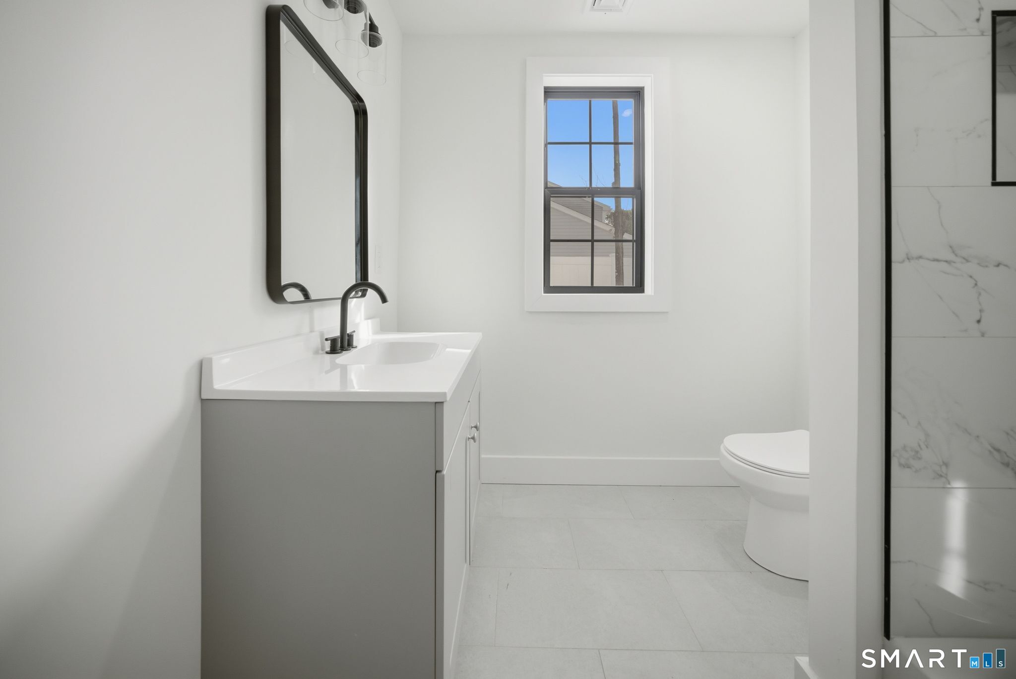 101 Parade Hill Road New Canaan, CT 06840 - Photo 34 of 40 a bathroom with a toilet sink and mirror