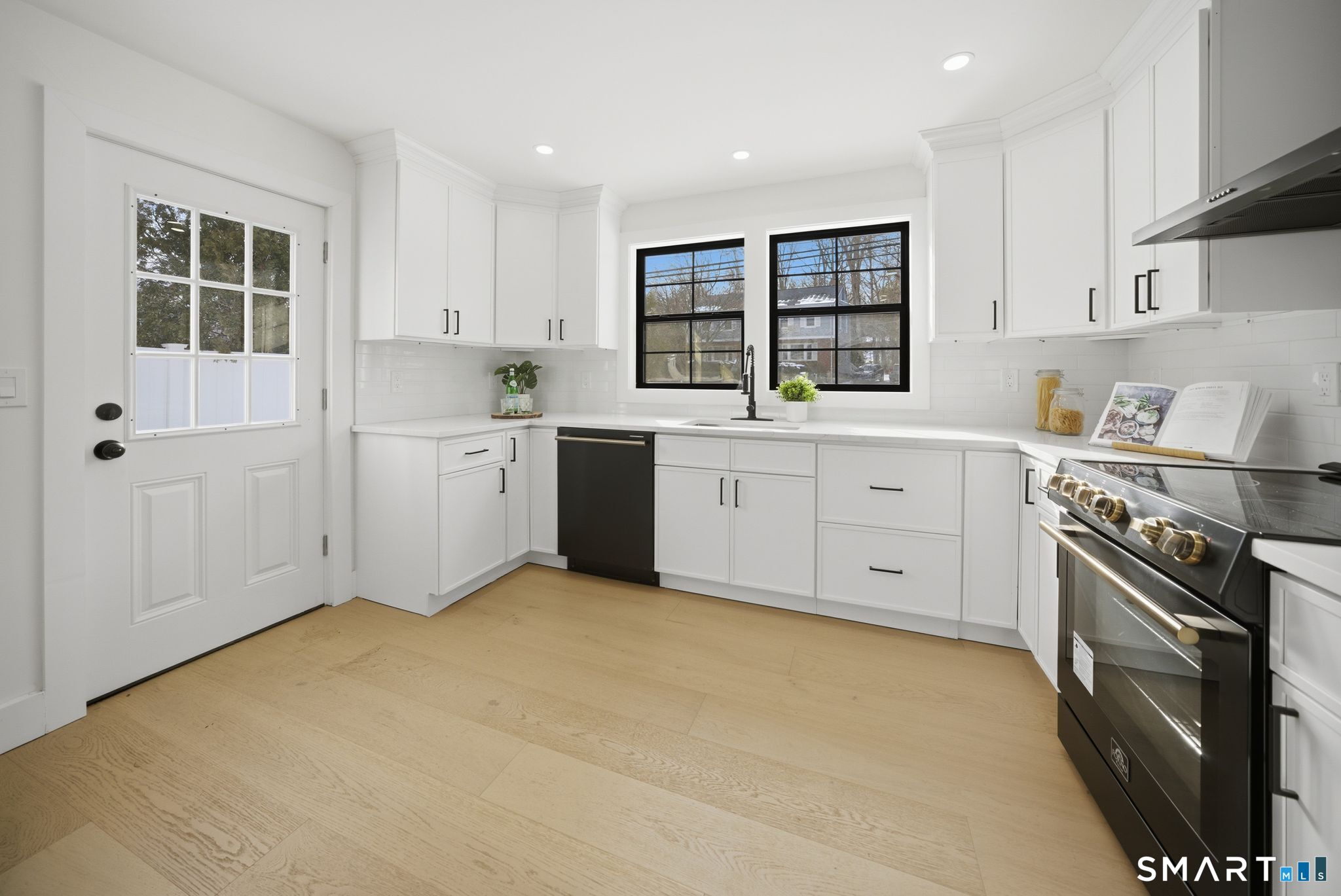 101 Parade Hill Road New Canaan, CT 06840 - Photo 4 of 40 a kitchen with granite countertop a stove sink and cabinets
