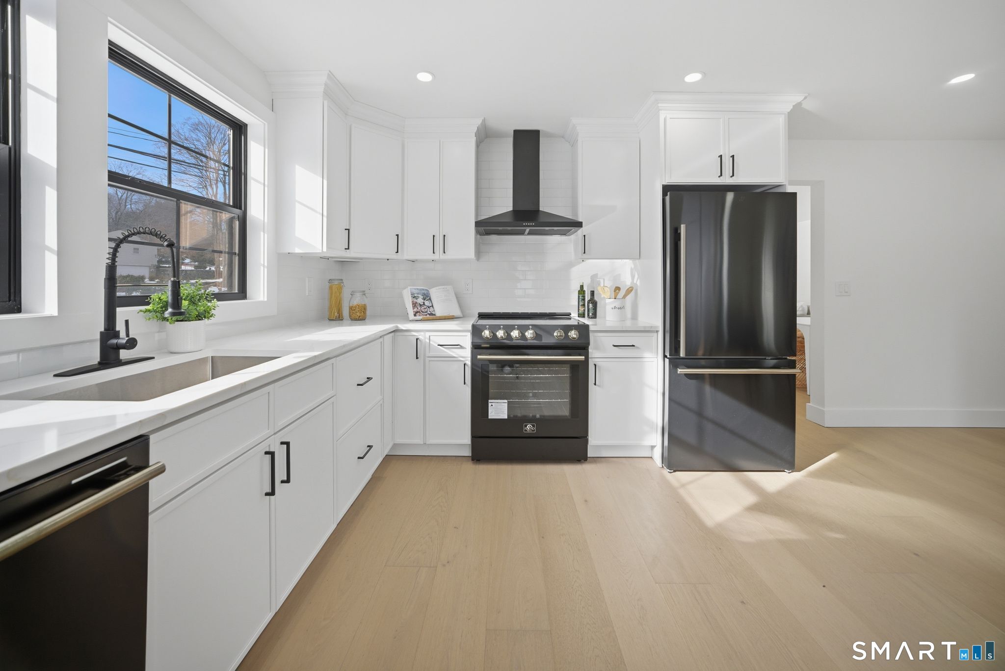 101 Parade Hill Road New Canaan, CT 06840 - Photo 5 of 40 a kitchen with granite countertop a refrigerator and a sink