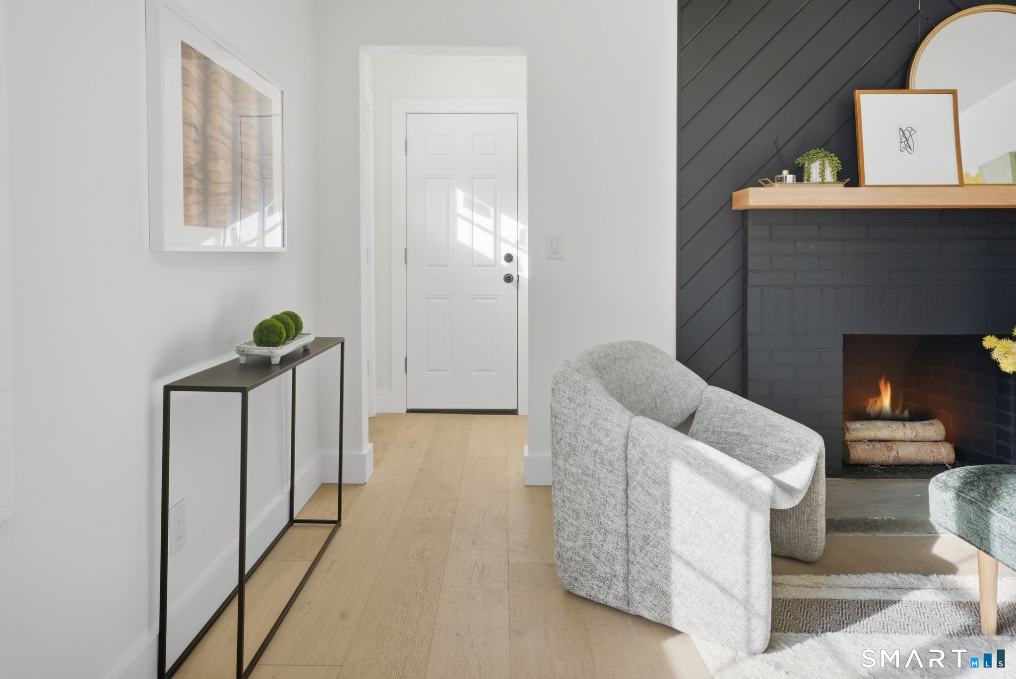 101 Parade Hill Road New Canaan, CT 06840 - Photo 10 of 40 a living room with furniture and a fireplace