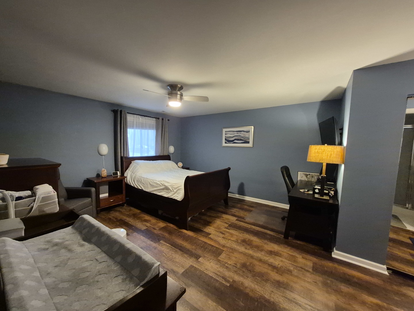 8216 Mulberry Court, Unit 8B Palos Hills, IL 60465 - Photo 14 of 22 a bedroom with a bed and wooden floor