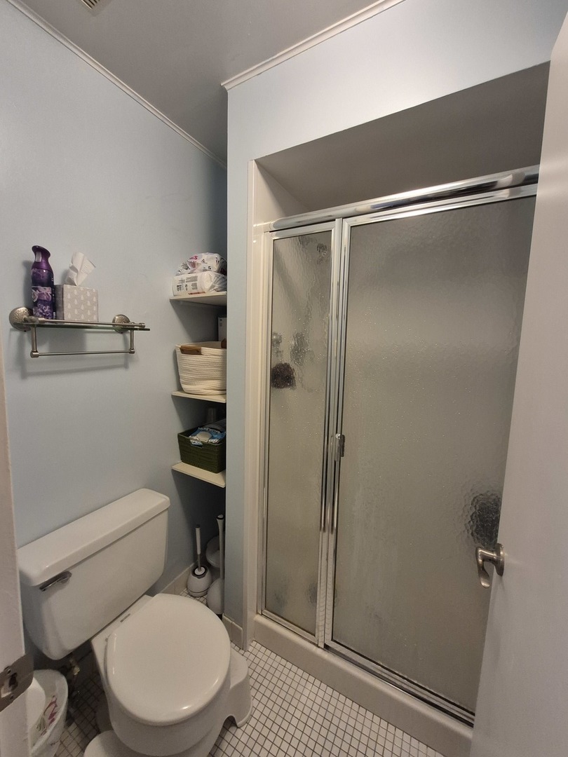 8216 Mulberry Court, Unit 8B Palos Hills, IL 60465 - Photo 15 of 22 a bathroom with a toilet and a shower