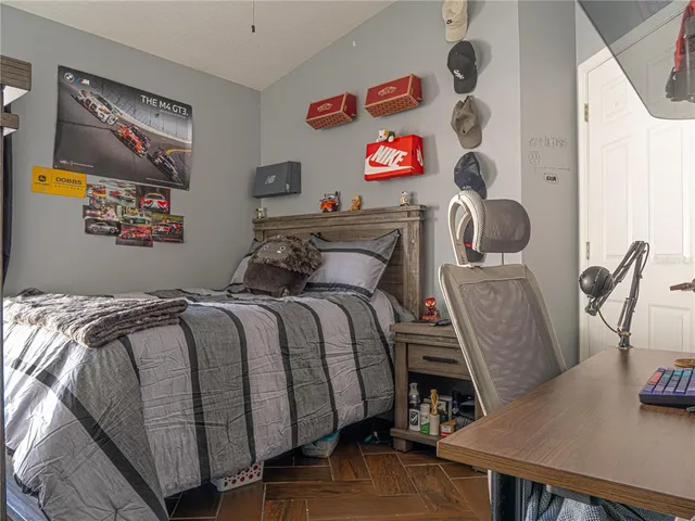 a bedroom with a bed and furniture