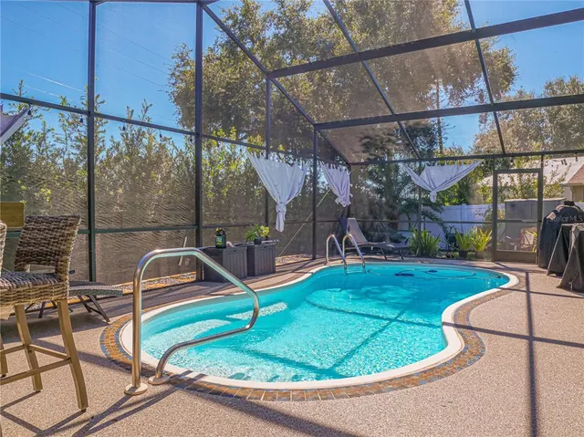 a view of a swimming pool with a patio