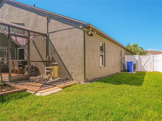 a view of backyard with a small cabin