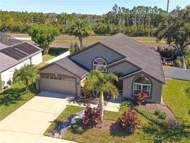 a aerial view of a house with a yard