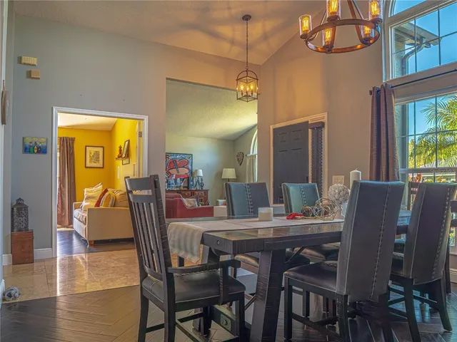 a dining room with furniture and window
