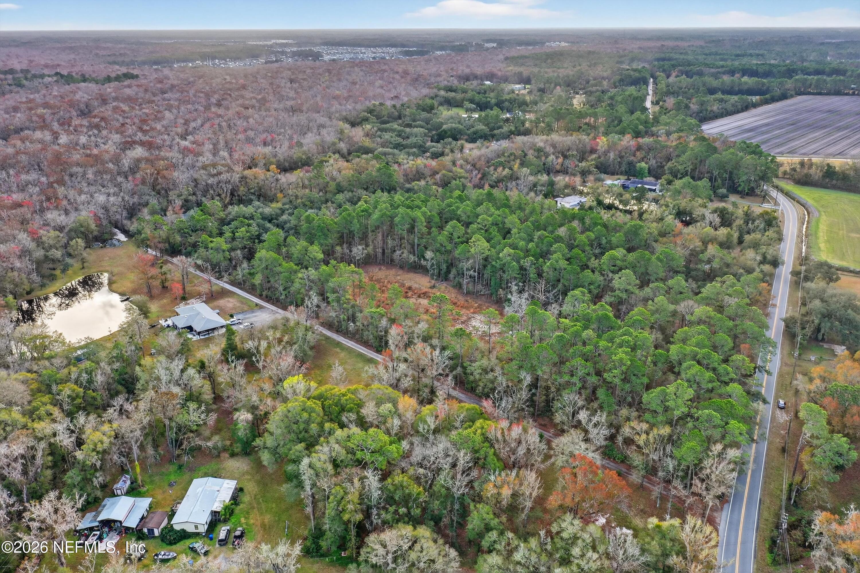 3570 Joe Ashton Road St. Augustine, FL 32092 - Photo 3 of 22 an aerial view of a houses with a yard and mountain