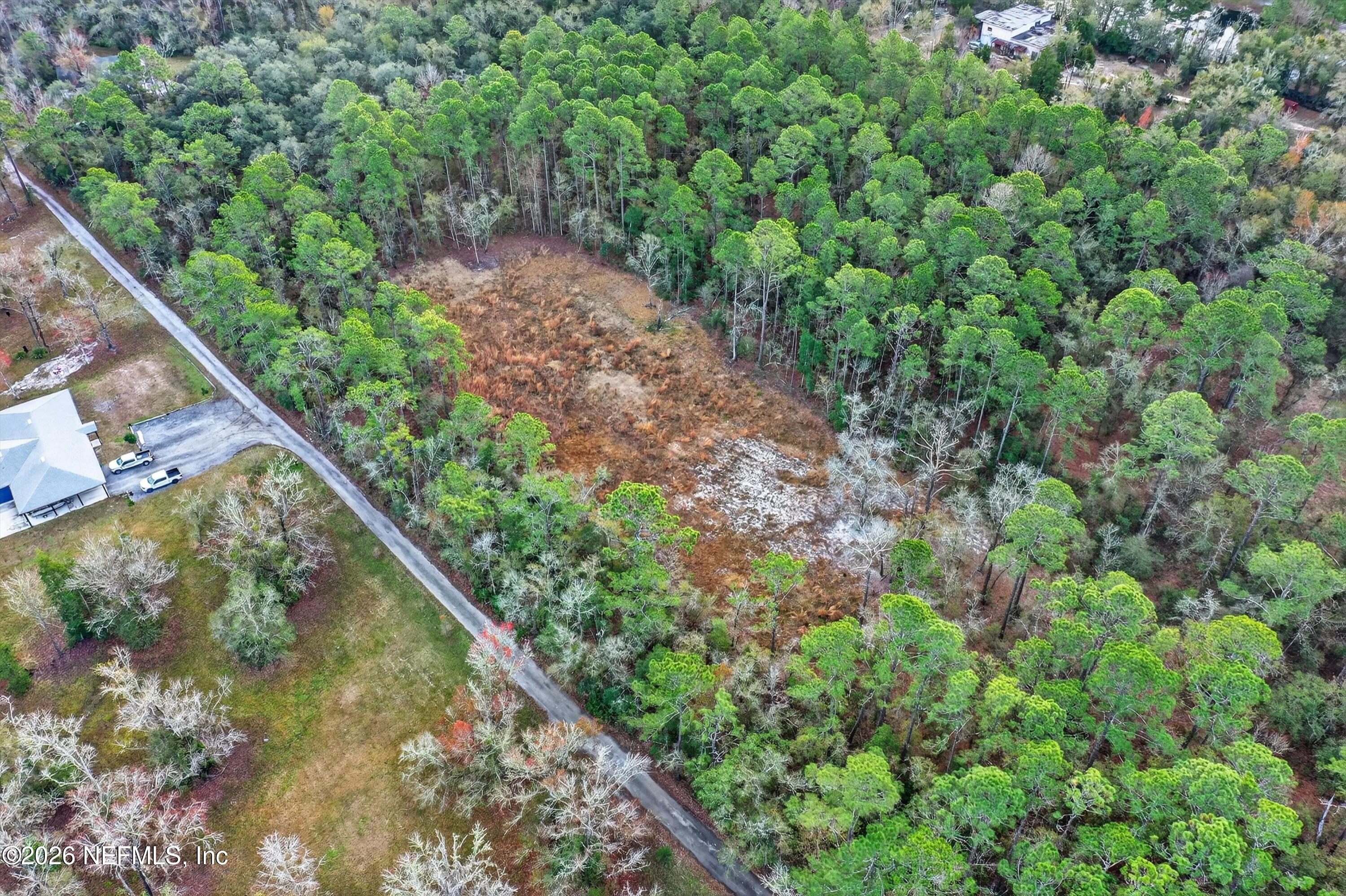 3570 Joe Ashton Road St. Augustine, FL 32092 - Photo 8 of 22 a view of a garden with a lake