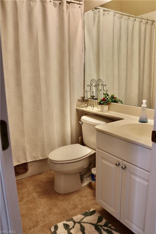 15474 Los Reyes Lane Naples, FL 34110 - Photo 19 of 36 a bathroom with a sink toilet and shower