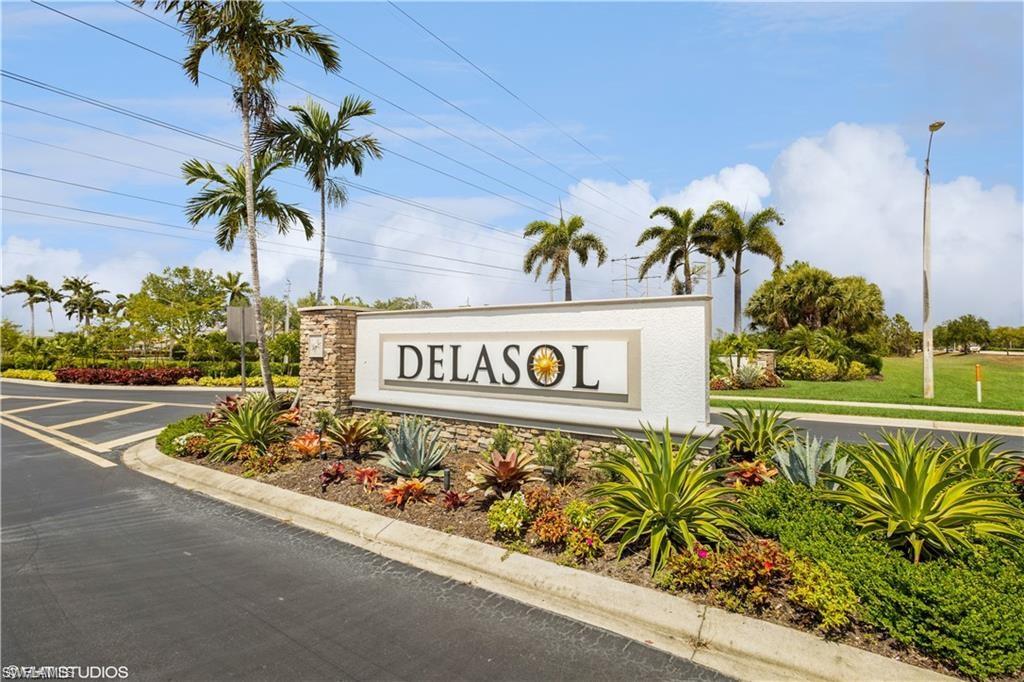 15474 Los Reyes Lane Naples, FL 34110 - Photo 2 of 36 a street sign on the side of a building