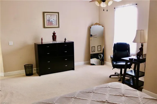 a room with a mirror and furniture