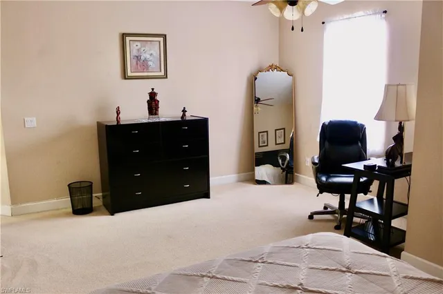 a room with a mirror and furniture