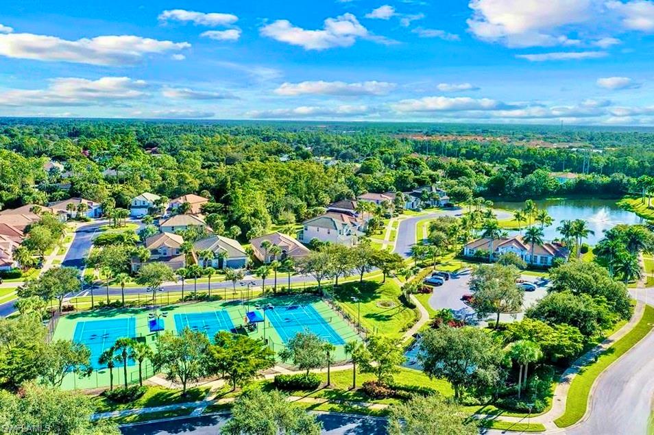 15474 Los Reyes Lane Naples, FL 34110 - Photo 33 of 36 a view of a lake with a city