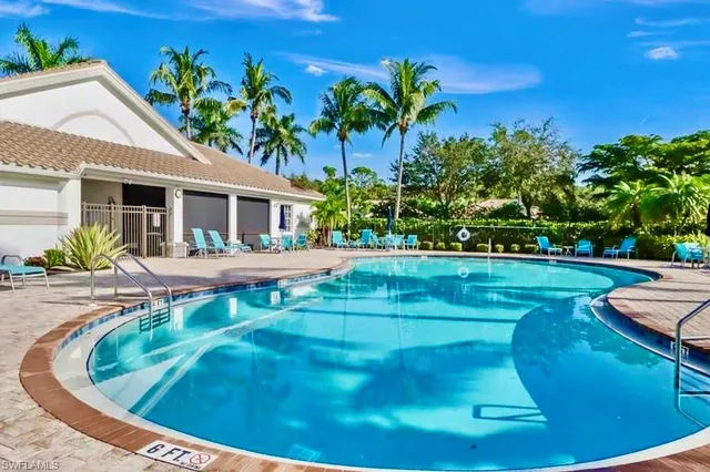 a view of a swimming pool with a patio