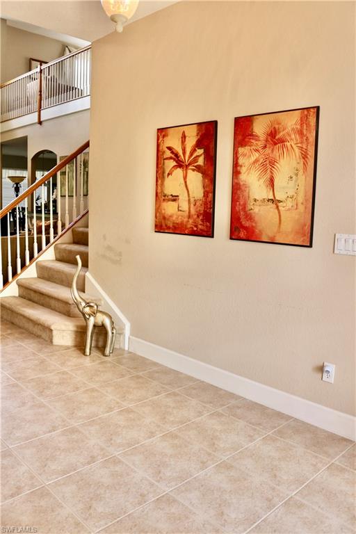 15474 Los Reyes Lane Naples, FL 34110 - Photo 4 of 36 a bathroom with mirror and a sink