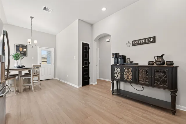a view of a chairs and table in a room