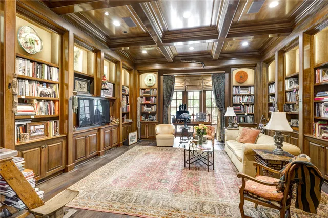 a living room with lots of furniture and large windows
