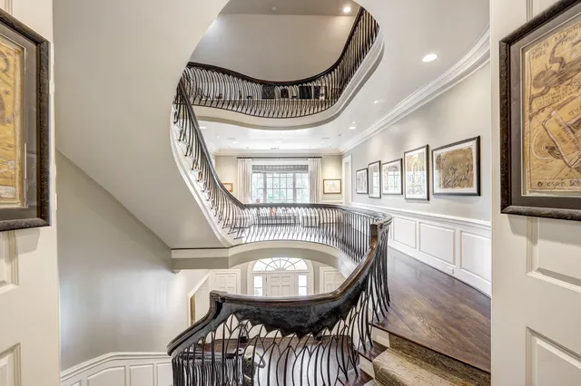 a view of a hallway with furniture