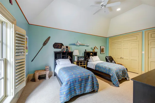 a bedroom with two beds and painted walls