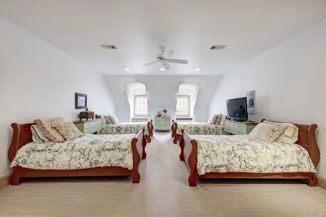 a bedroom with bed and a couch