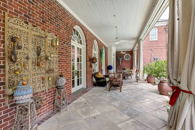 a lobby with furniture and potted plants
